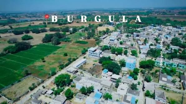 Burgula village aerial view, rural homes and surrounding community